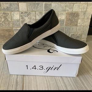 Womans New Black faux snake slip on sneaker.
